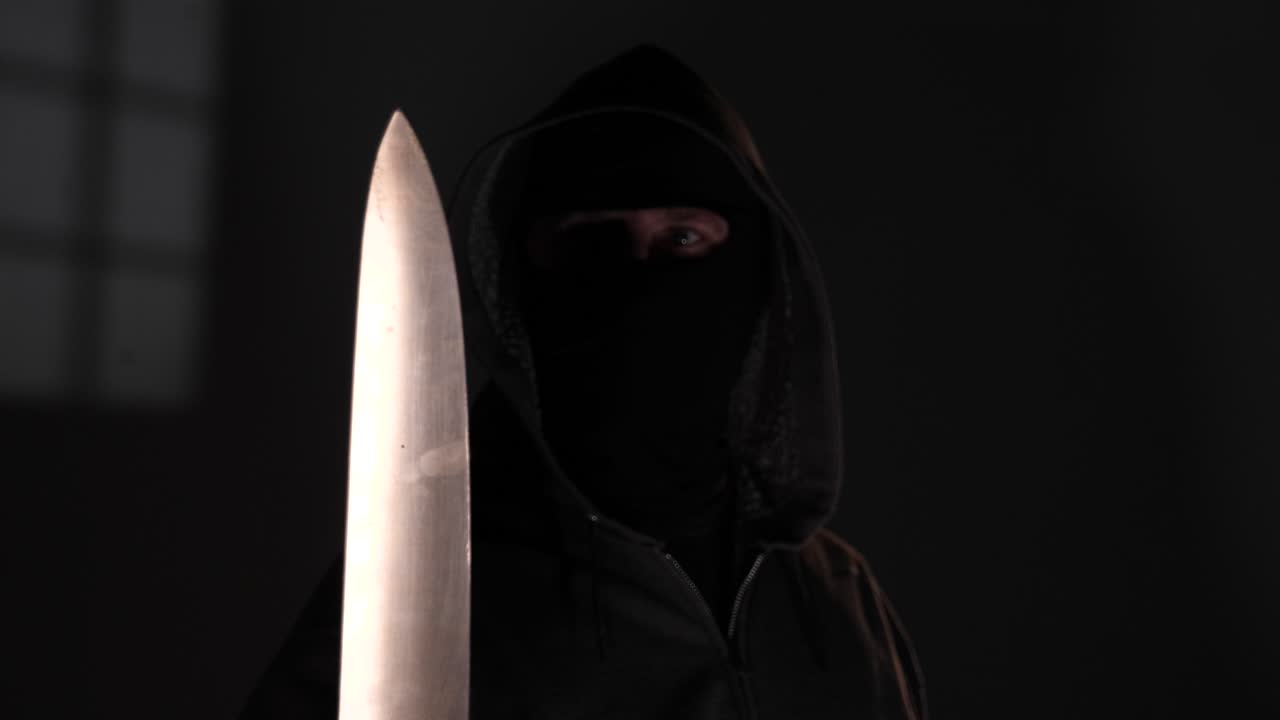 Burglar Robber invades a home with a gun knife and crowbar