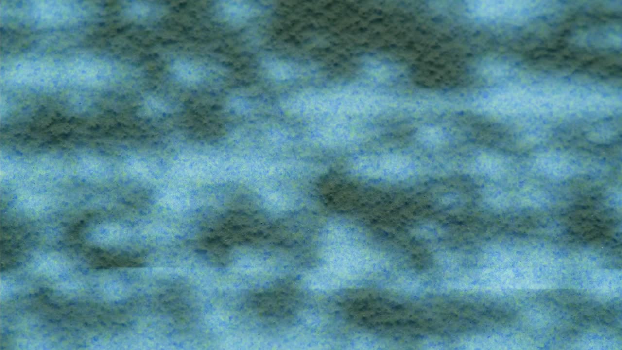 A retro TV displaying static noise, creating a nostalgic vintage atmosphere with blue and green hues.