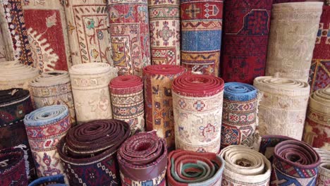rolled rugs display in a store
