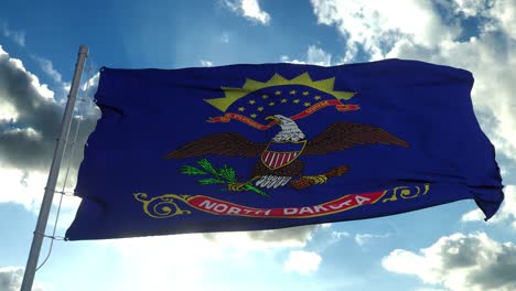 state flag of north dakota waving in the wind. blue sky background