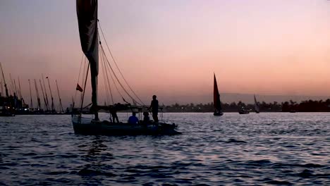 nile sail boat on the nile in luxor at sunset in the beautiful and historic egypt