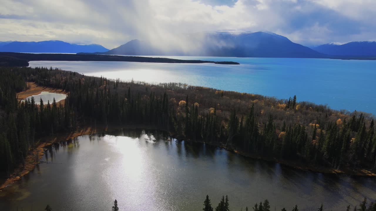 Sunset aerial scenic view of Atlin Lake on a cloudy day