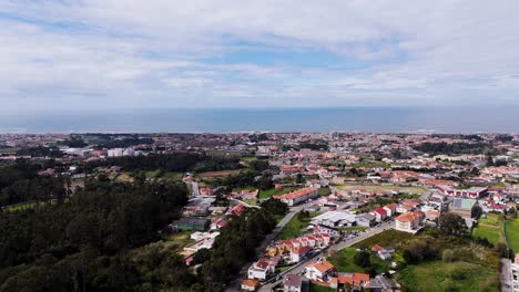 Aerial Canidelo neighborhood with sea and forest in Gaia Portugal