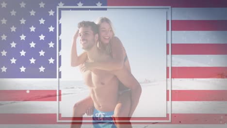 Schwenkende-Amerikanische-Flagge-Gegen-Kaukasischen-Mann,-Der-Seiner-Frau-Eine-Huckepackfahrt-Am-Strand-Gibt