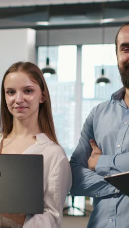 vertical video portrait of teamworking engineers writing code, developing machine learning apis