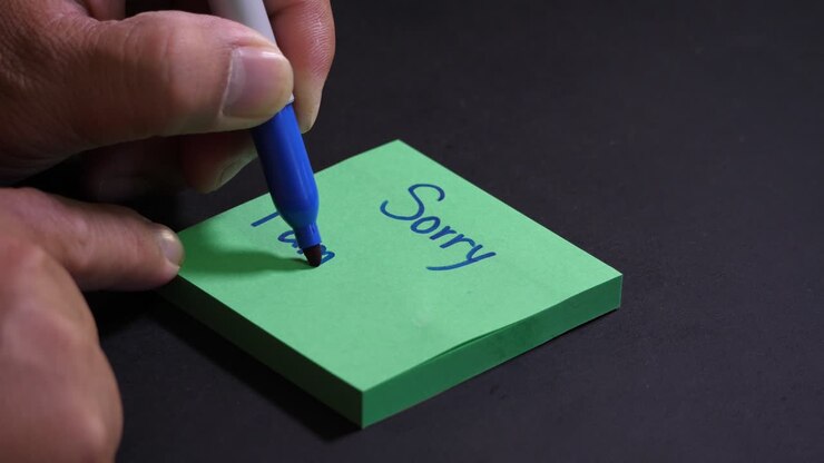 Sorry I Am late, handwritten on sticky post-it note colorful paper by hand