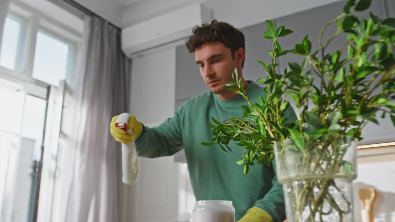 Man hands wiping dirt doing routine chores at home closeup. Guy cleaning kitchen