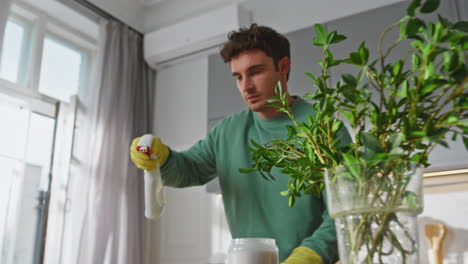 man hands wiping dirt doing routine chores at home closeup. guy cleaning kitchen