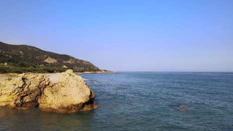 Aerial-drone-clip-over-a-beautiful-beach-in-Kavala,-Macedonia,-Greece