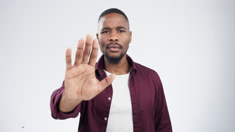 stop, hands and face of black man in studio