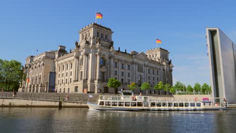 boat passing reichstag building germany