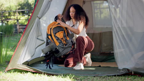 woman, packing and backpack for outdoor hiking