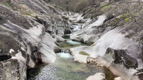 panning up revealing garganta de los infiernos natural pools, spanish natural reserve