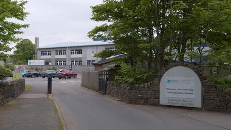 static shot of a small college and university campus in the castle grounds forest near the lews castle in stornoway