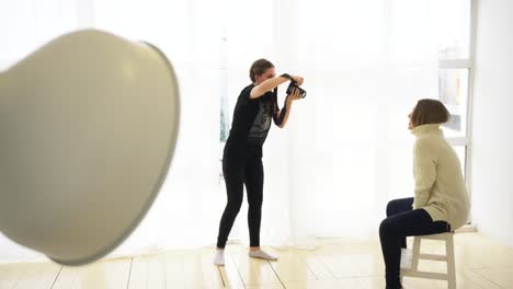 photographer taking a portrait photo of a woman