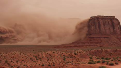 dramatic dust storm sweeps through monument valley