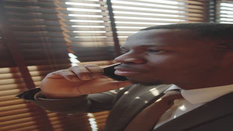 Afro-American-Businessman-Speaking-on-Mobile-Phone