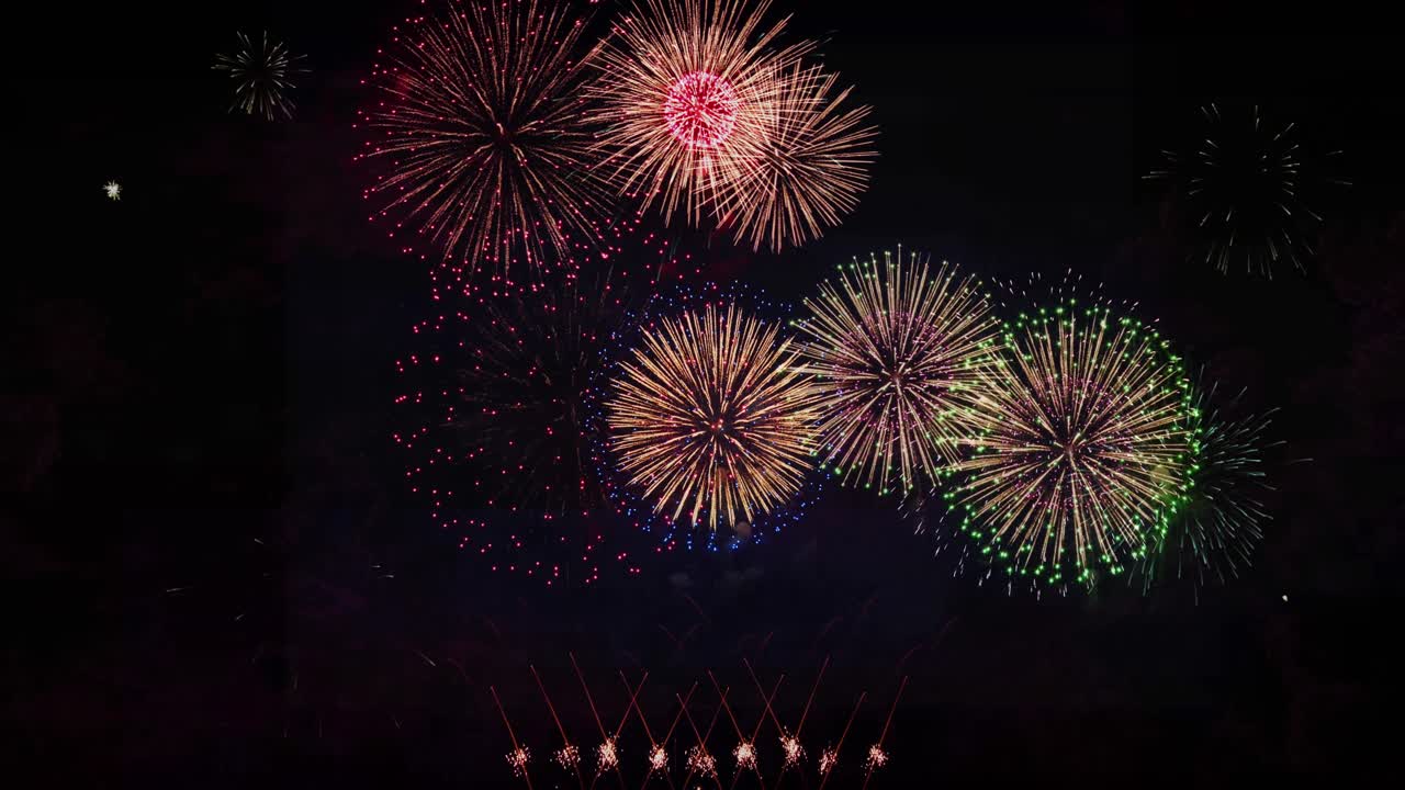 Colorful fireworks lights sky with bokeh background with copy space for new year celebration