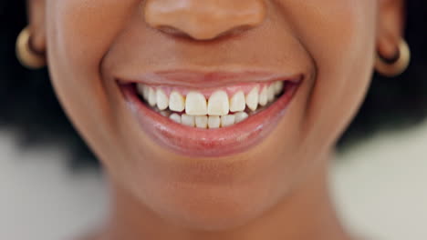 Closeup-of-smiling-dentist-showing-white-teeth