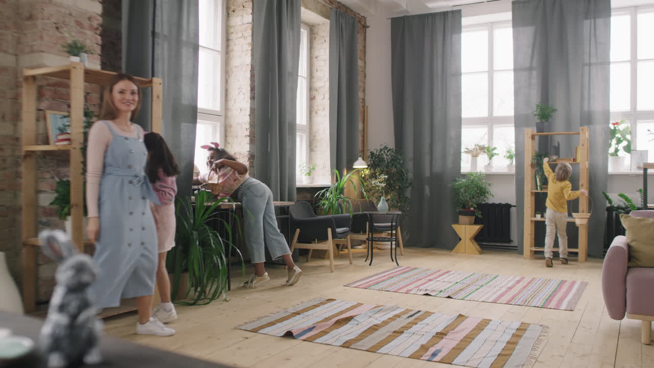 Happy Kids on Easter Eggs Hunt at Home