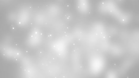 animation of white glowing spots falling on grey background