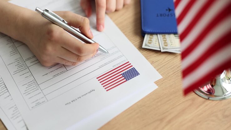 Person filling out a USA visa application form