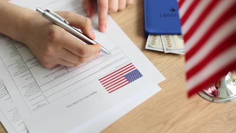 person filling out a usa visa application form