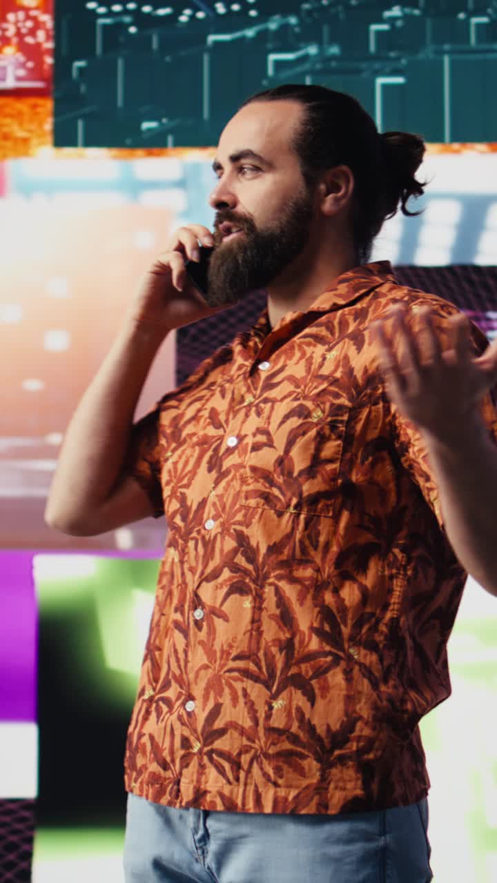 Vertical Video Artistic person and DJ answering phone call under vibrant neon lights
