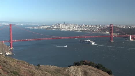 panorama shot of san francisco with golden gate bridge and freighters in the ocean, california, usa