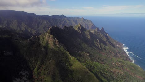 Aerial-4K-shot-of-volcanic-prehistoric-beaked-mountains-of-Anaga-National-park-in-the-Canary-Islands-of-Spain