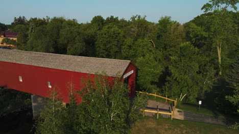 red building of zumbrota covered bridge spanning the north fork of zumbro river