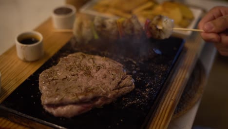 a chief cooks food on a grill, close up shot, insert sot