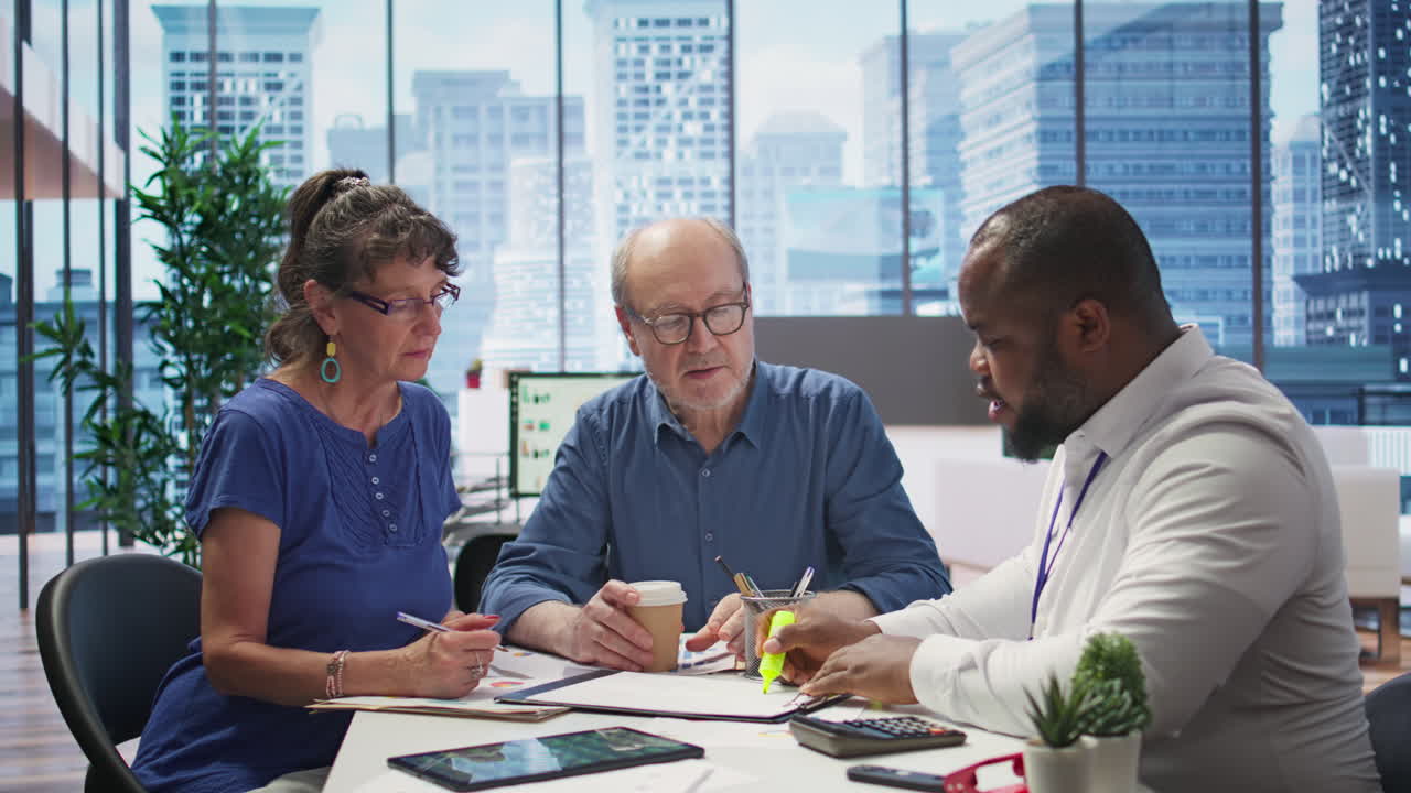 Mature couple receiving professional advice on retirement planning