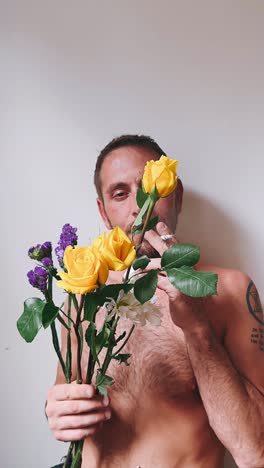 man with flowers and a cigarette