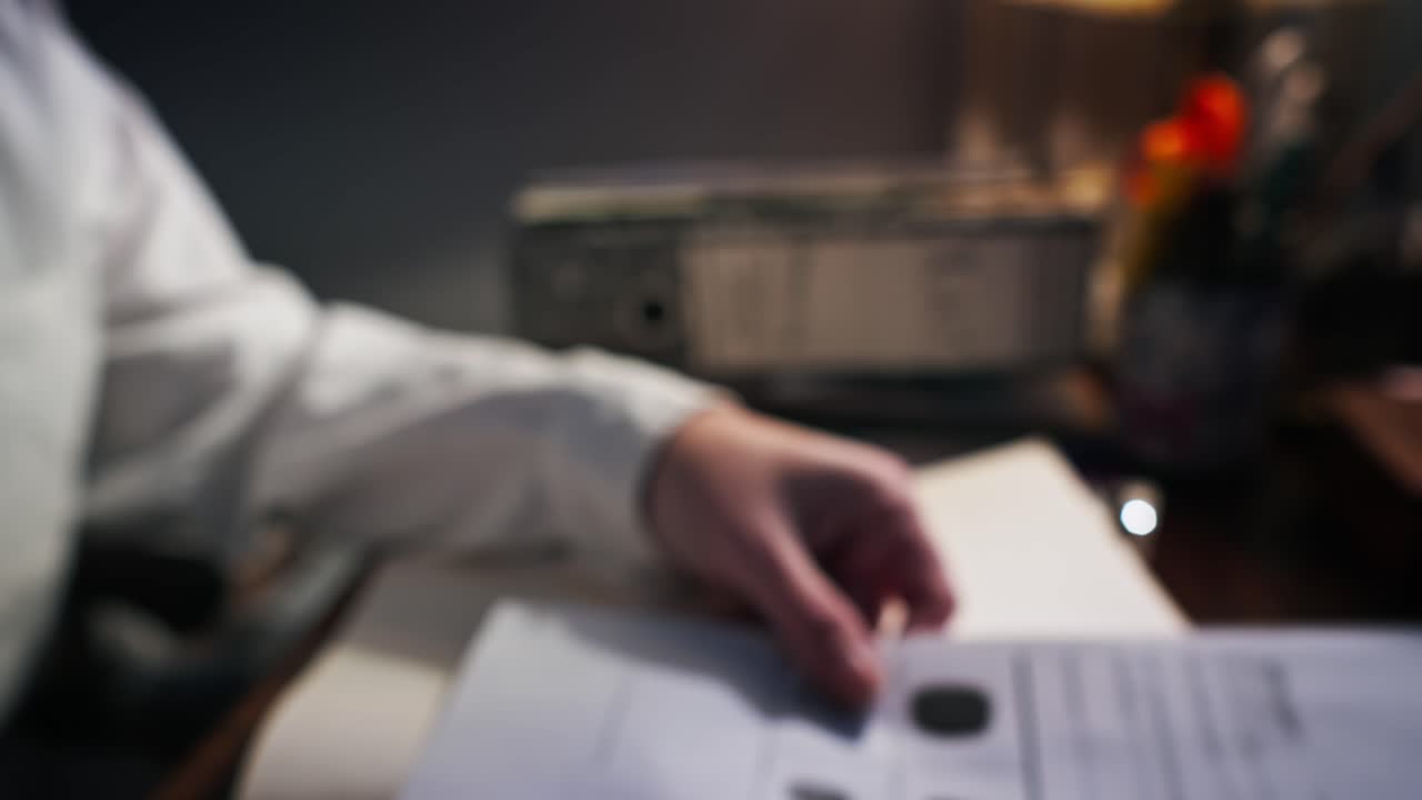 Forensic lab investigator records fingerprint evidence on dictaphone