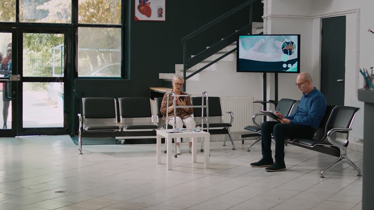 Health specialist attending checkup visit exam with elderly woman