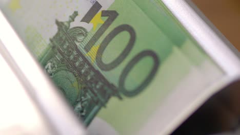 machine counter automatic calculates a large amount of euro banknotes in 4k slow motion 60fps