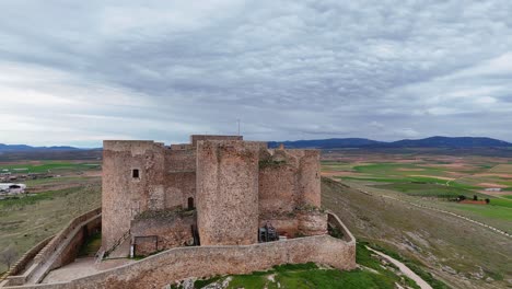 drone view of consuegra castle and windmills