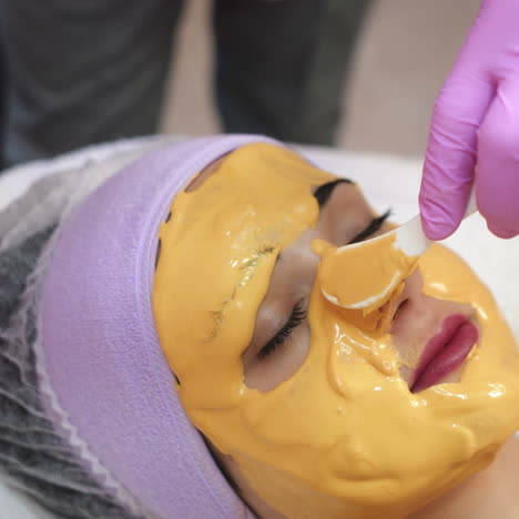 young woman gets beauty facial injections in salon. face aging, rejuvenation and hydration procedures. aesthetic cosmetology.