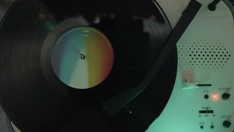 overhead shot of turntable on and vinyl spinning