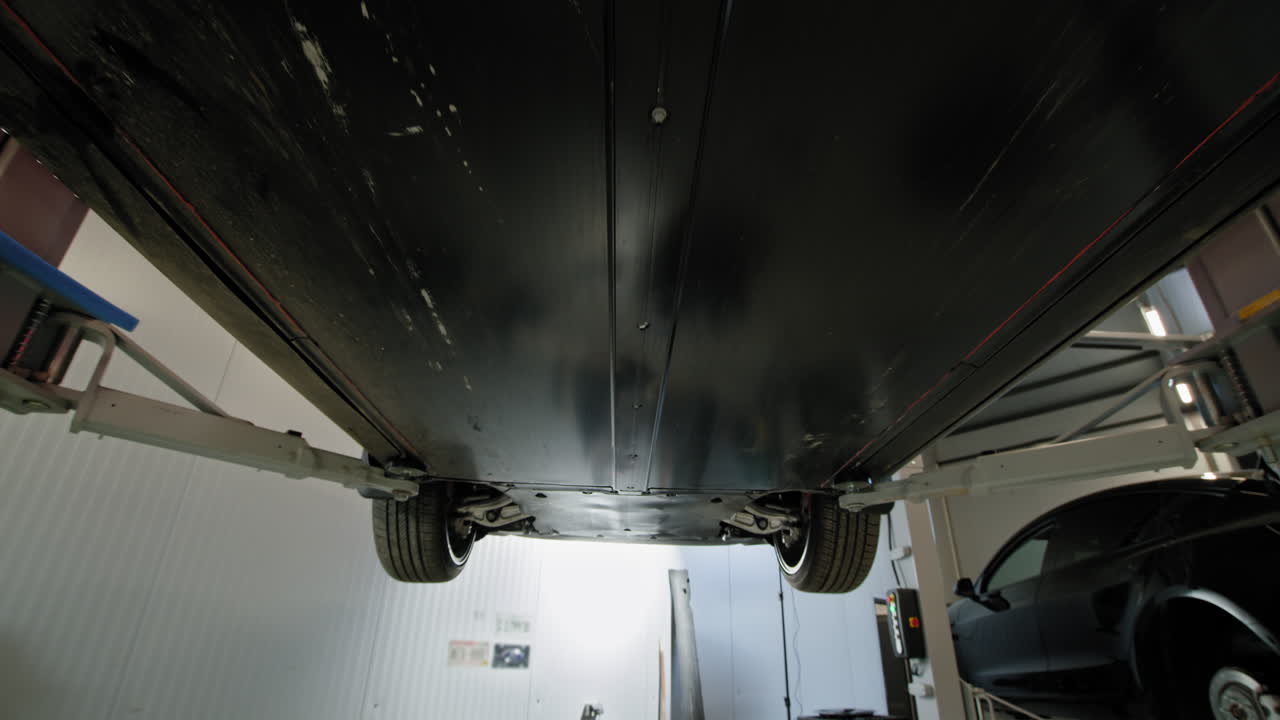 Electric Vehicle Undercarriage Maintenance in a Repair Shop