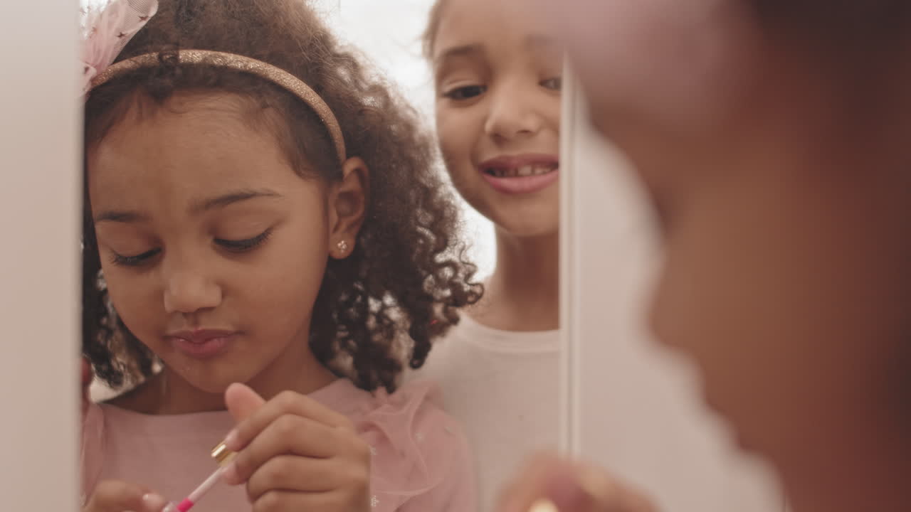 Little Sisters Experimenting with Makeup