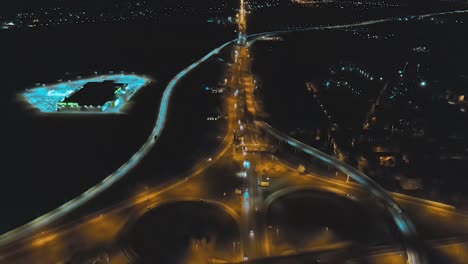 night highway interchange aerial view