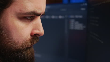 software engineer concerned, concentrating on finding code bugs, close up