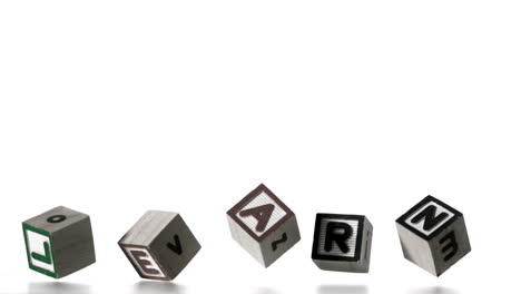 learn spelled out in letter blocks falling over