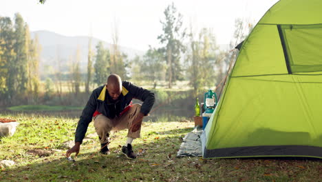 camping, tent and black man setup in nature