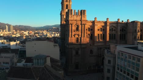 Drone-view-Old-And-Historic-Malaga-Cathedral-At-Sunset-In-Andalusia,-Southern-Spain