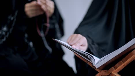 close up hand of young muslim woman while read quran