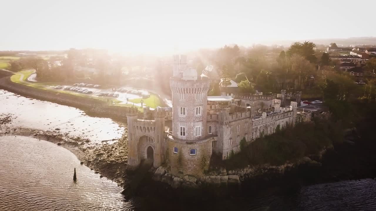 Black Rock castle aerial drone footage from far with sun flares