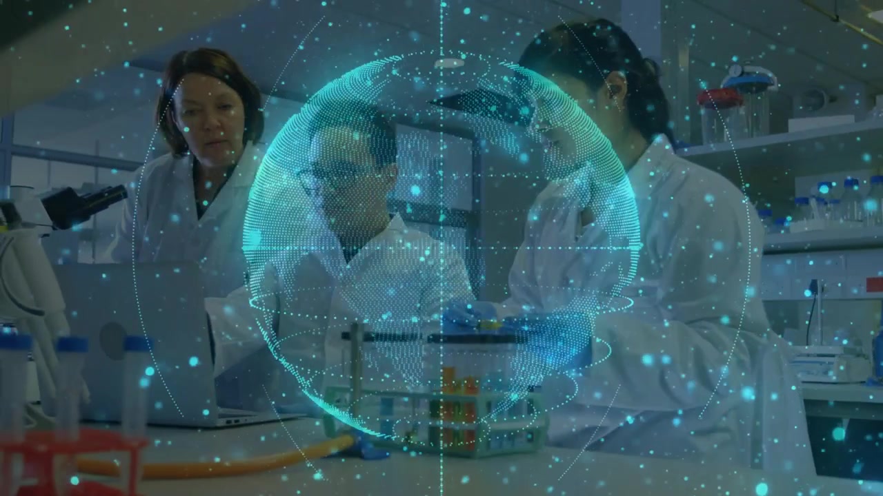 Küre oluşurken, kıdemli bilim insanı iş birliği yapıyor, asistan ise laboratuvar araştırması için tüpleri yerleştiriyor.